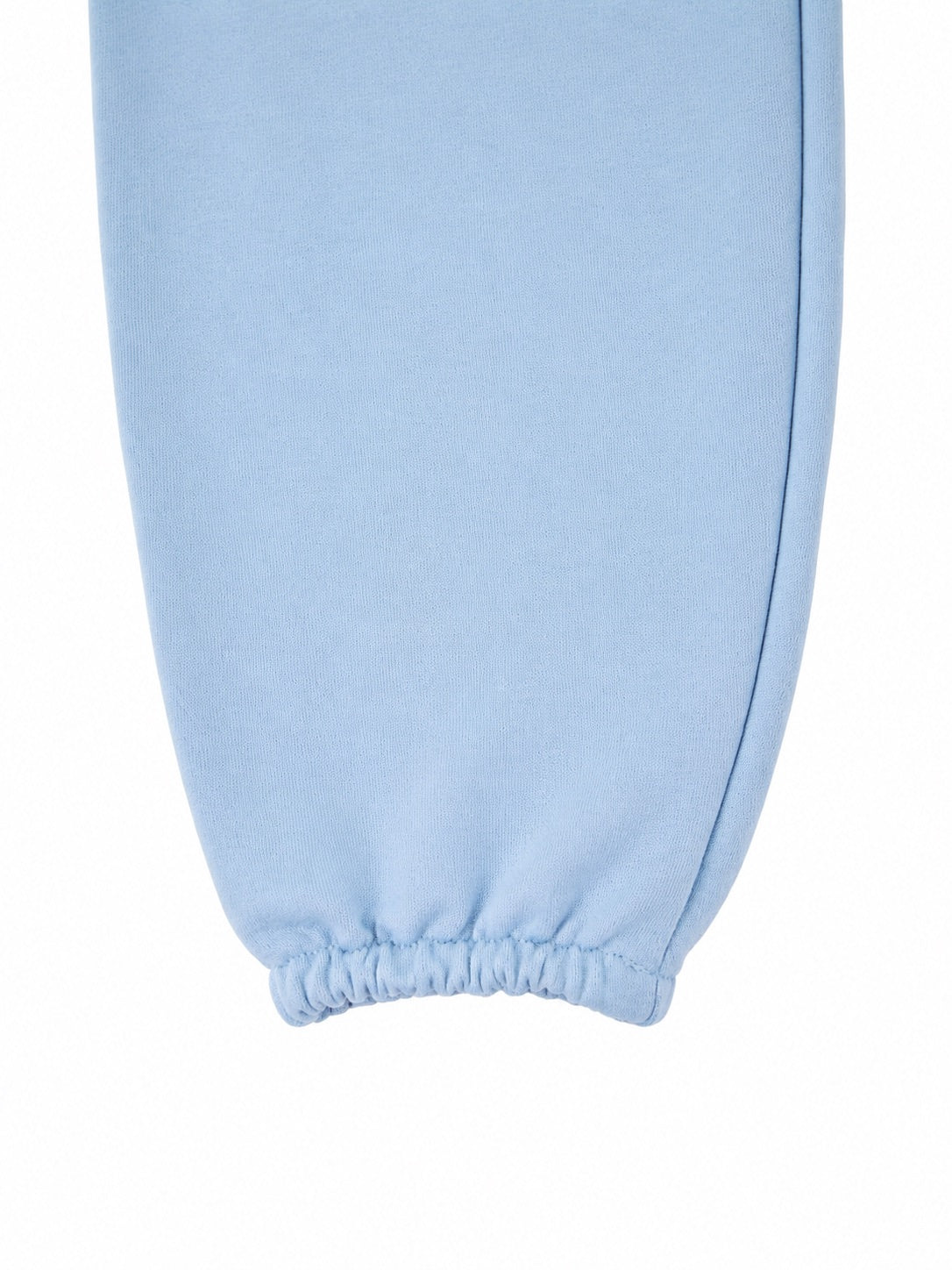 Damskie spodnie dresowe oversize UNLEASH WINGS PASTEL BLUE WINGS UNLEASH