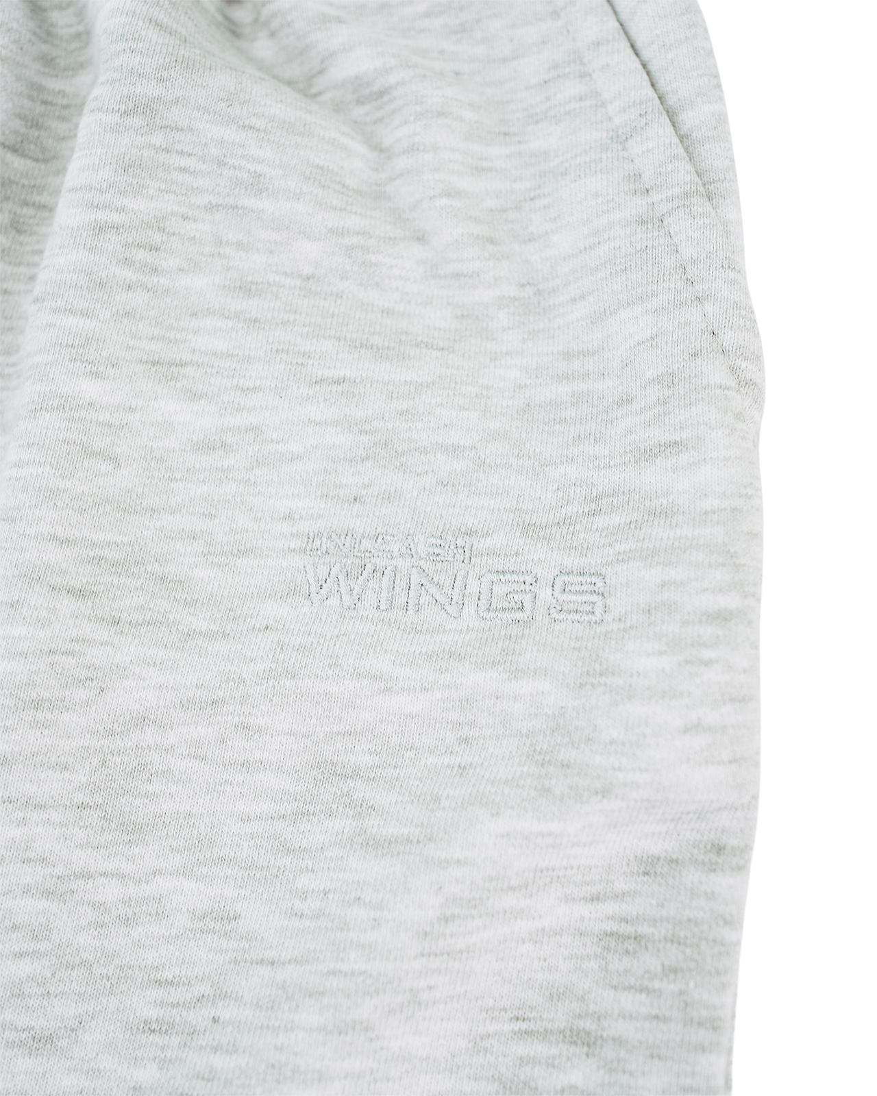 Pantalones cortos deportivos para mujer UNLEASH WINGS GRIS