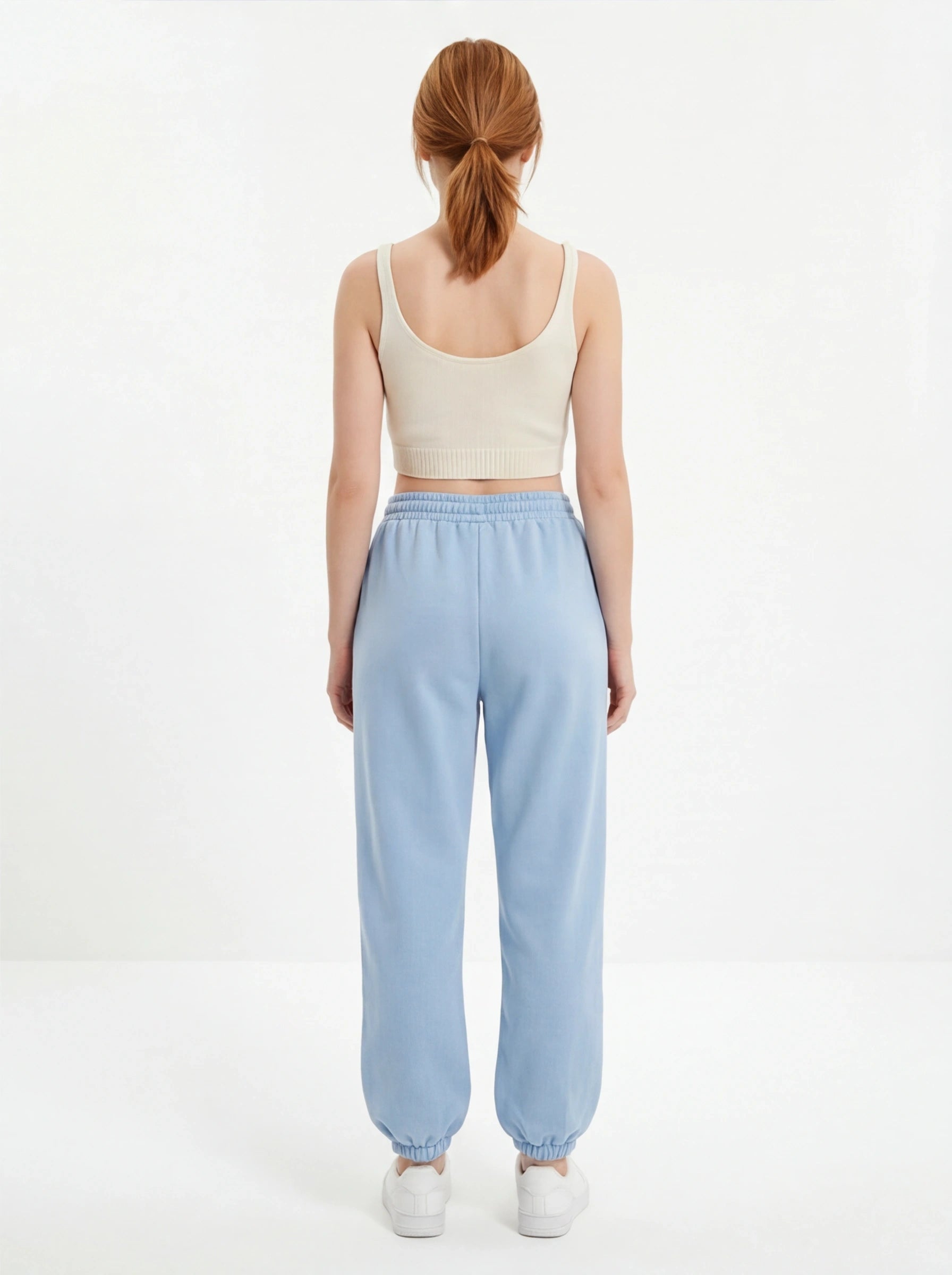 Damskie spodnie dresowe oversize UNLEASH WINGS PASTEL BLUE WINGS UNLEASH