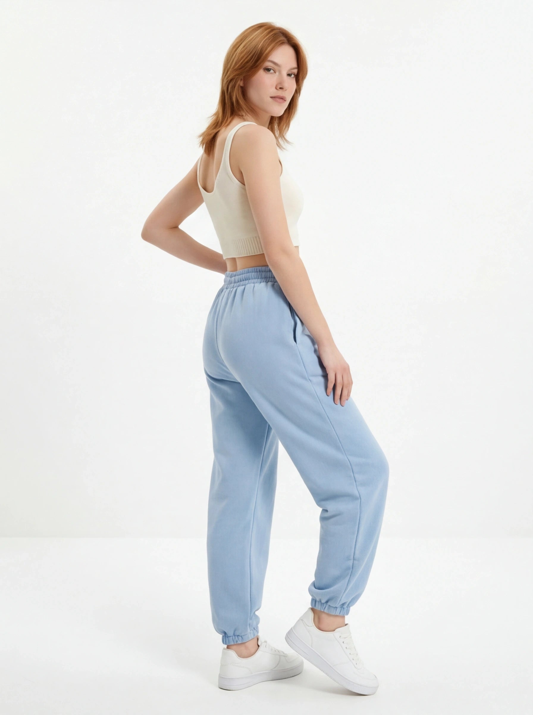 Damskie spodnie dresowe oversize UNLEASH WINGS PASTEL BLUE WINGS UNLEASH